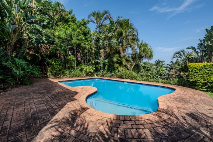 Umgeni Park House For Sale: Spacious family home with pool, garden, and garage.