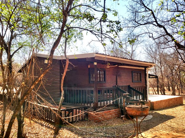 House for Sale in Marloth Park Central: 2 beds, deck, wildlife views, spacious land.