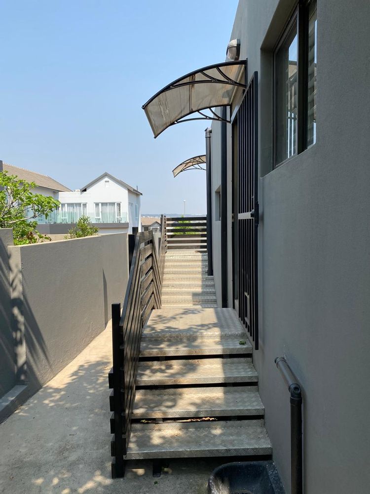 Stairs from outside to kitchen and scullery