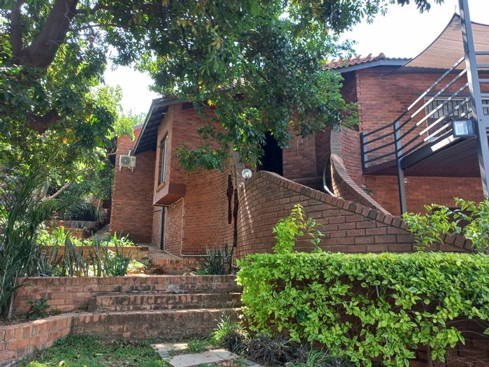 Spacious dual-residence house in Safari Gardens with pool, borehole, and ample parking. For Sale.