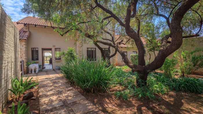 For Sale: Townhouse in The Coves with garden, double garage, and estate amenities.