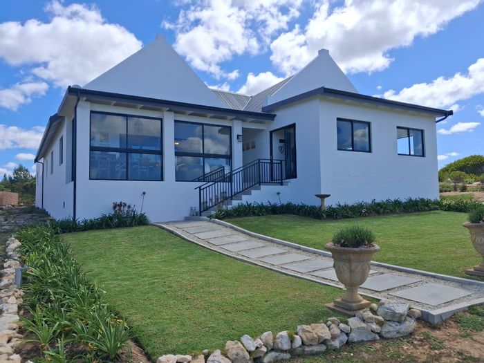 House for Sale in Stilbaai Oos: 2 Bedrooms, Private Slipway, Gated Estate.
