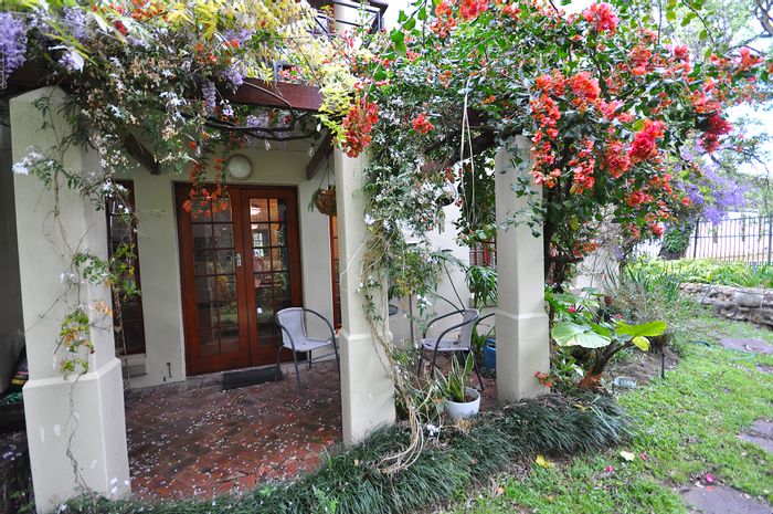 For Sale: Spacious 2-bedroom apartment with garden, garage, and secure living in Stellenbosch Central.
