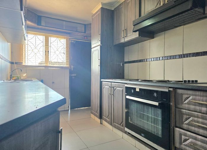 3-Bedroom House For Sale in Lotus Park with multiple lounges and secure parking.