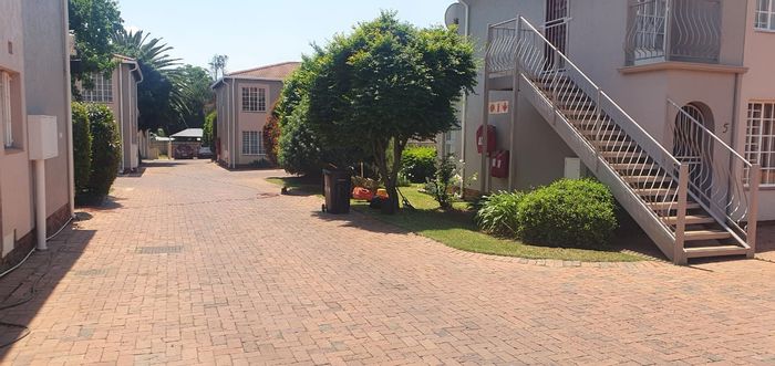 Lambton Townhouse For Sale: Ground-floor unit with private garden and parking bays.