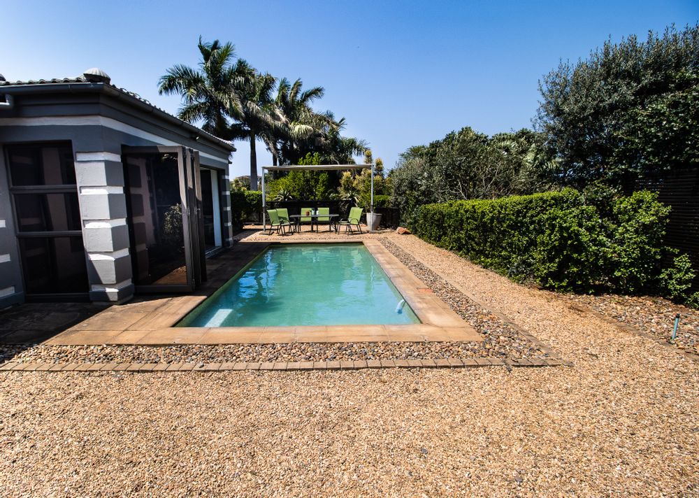 House front with pool & garden