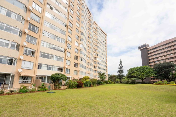 For Sale: Flat in Doonside with sea views, braai area, and secure garage.