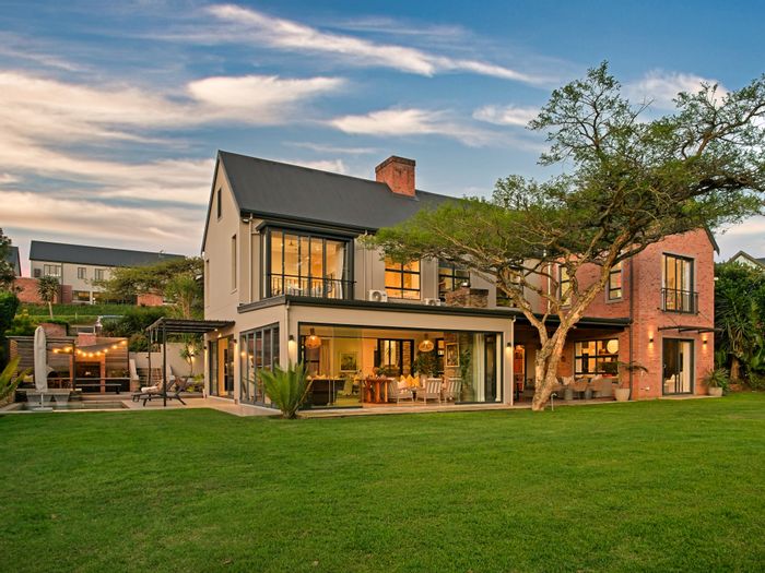 For Sale: House in The Gates with gourmet kitchen, wine cellar, and private dam.