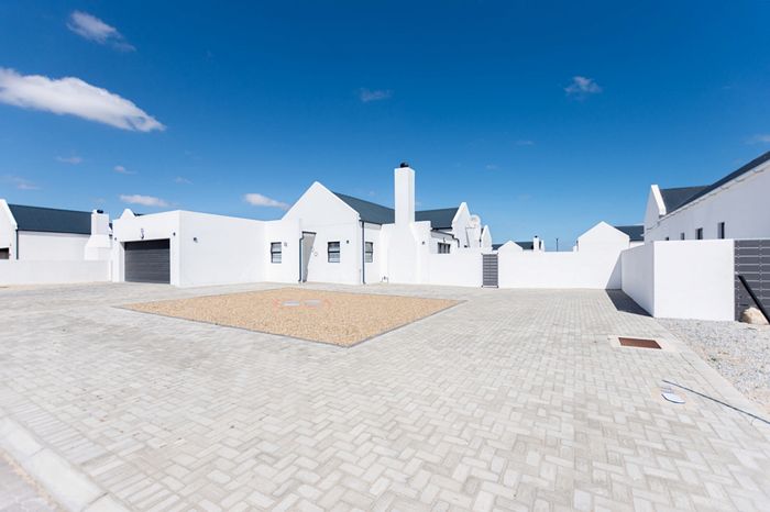 House For Sale in Atlantic Waves Estate: Beach access, garden, and double garage.