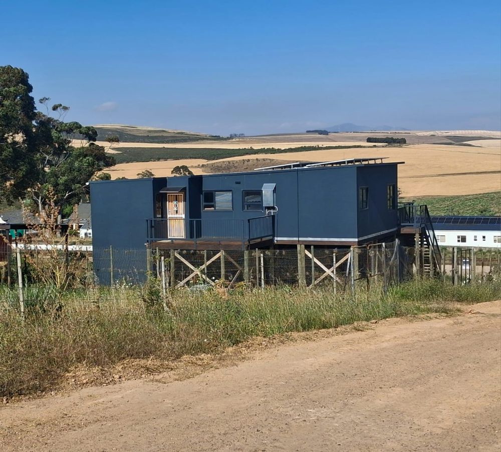 Back of house with deck for winter sun