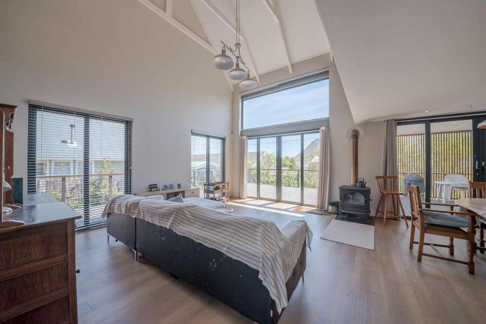 Double Volume open plan lounge/dining area, opening onto the large deck outside