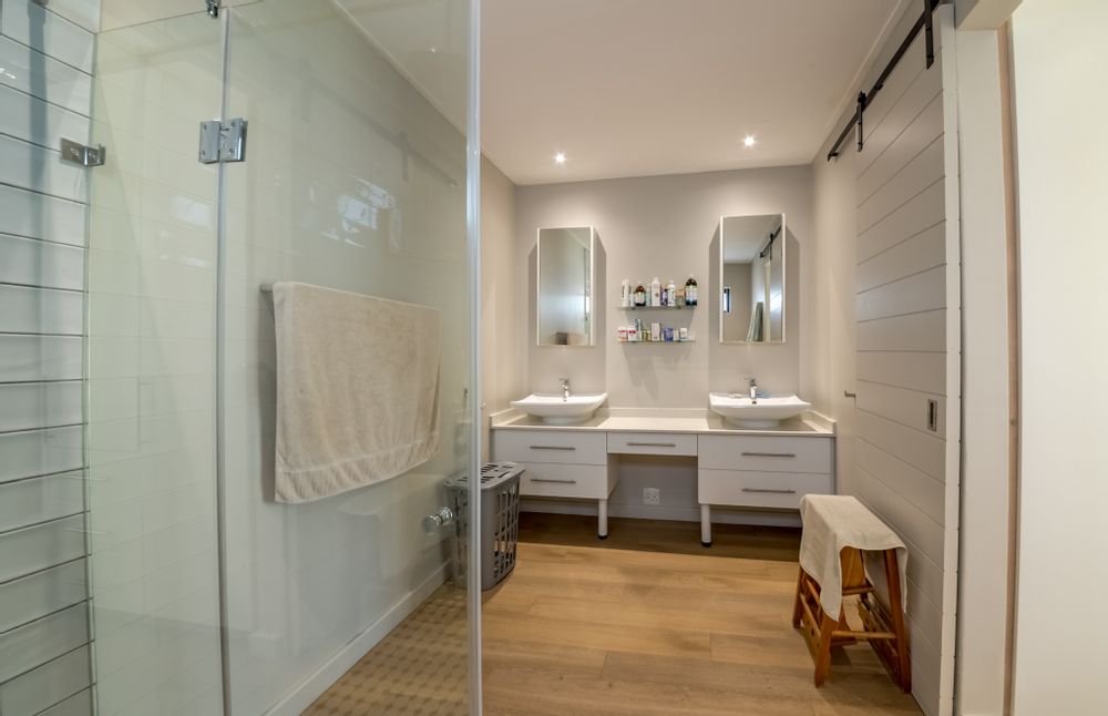 Main Bedroom en-suite with shower and twin basins