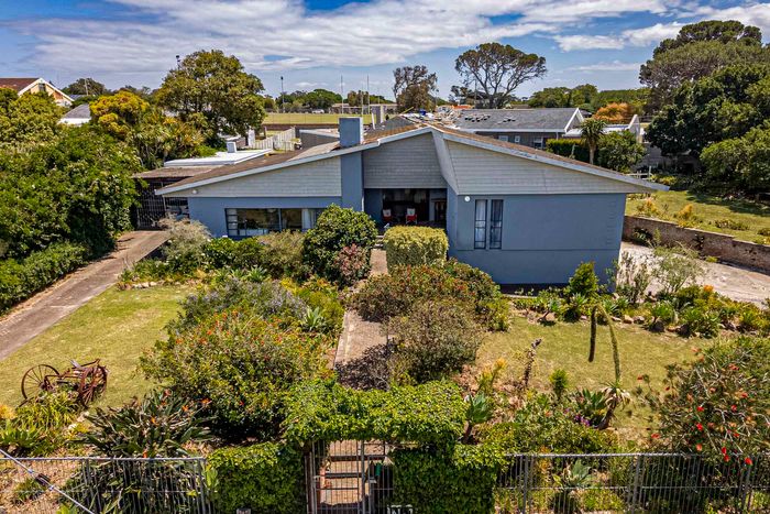 Spacious 4-bedroom house in Sunridge Park with garden, garage, and braai area. For Sale.