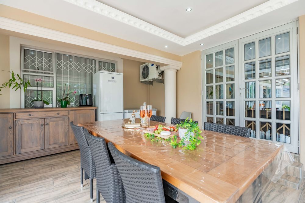 Lovely entertainment room with stackable doors opening to outside pool area