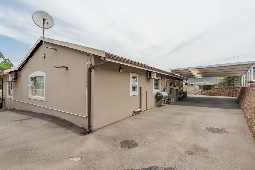 Back of house with carport for extra parking
