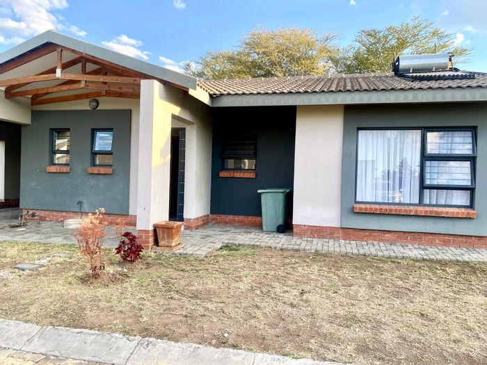 3-Bedroom Townhouse To Rent in Waterkloof AH with pool, patio, and security features.