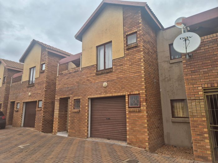 For Sale: Annadale Townhouse with 3 bedrooms, garage, and versatile living spaces.