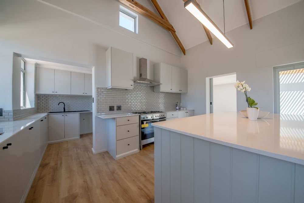 Kitchen leading to scullery into garage