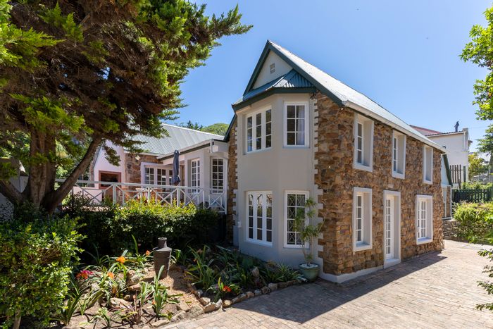 For Sale: House in West Bank with garden, bar, and guest cottage.