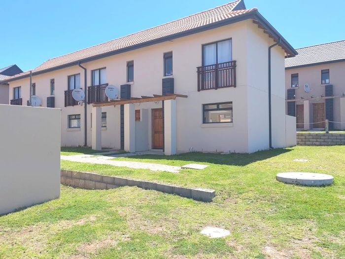 For Sale: 2-Bedroom Apartment in Kidds Beach with sea view, solar power, and security.