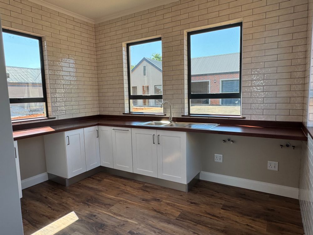 More than ample sized north facing scullery .