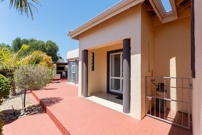 For Sale: House in Port Owen with pool, braai area, and spacious garden.