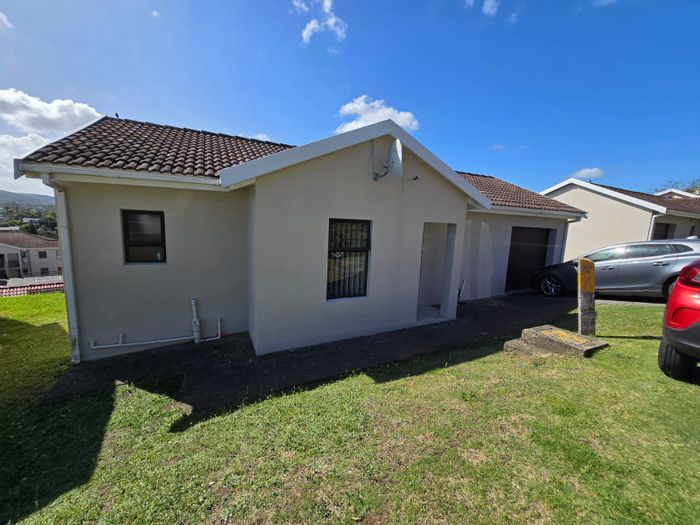 Two-bedroom house for sale in Nahoon Valley Park with garage and playground access.