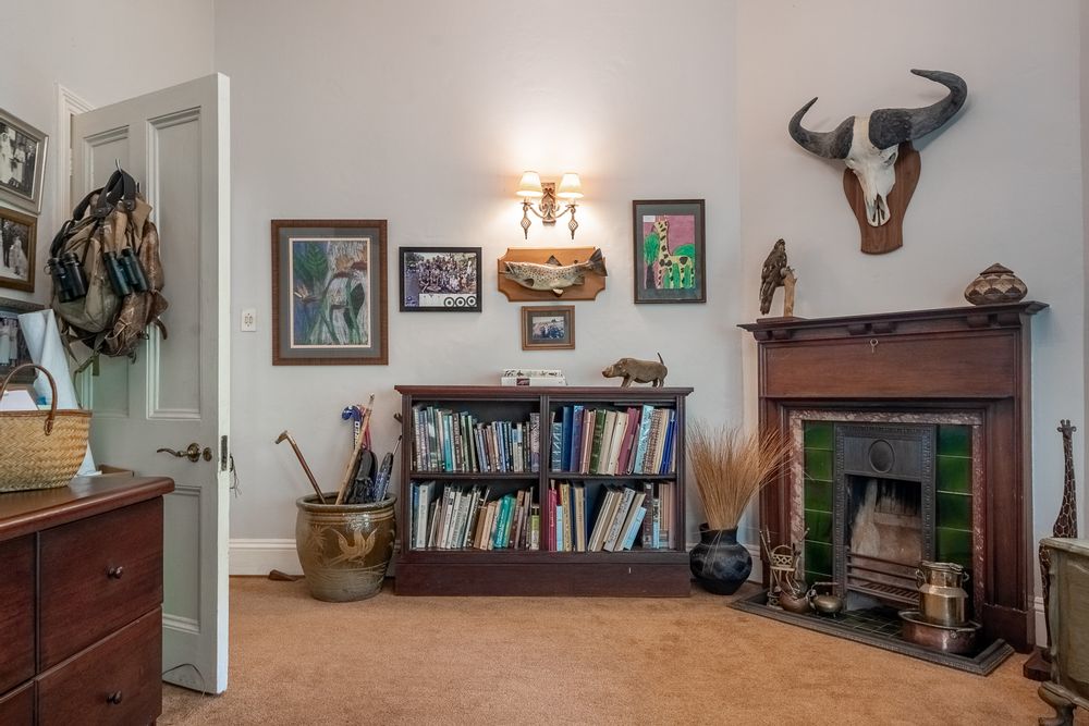 Study - Features fitted cupboards and fireplace