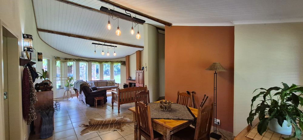 Open plan living and dining area with fireplace