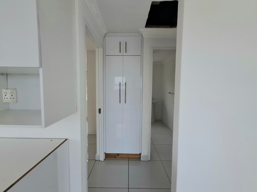 view from kitchen/ lounge leading to the bedrooms