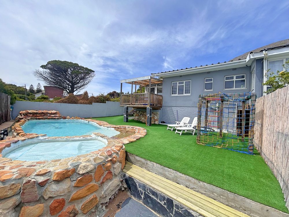 Unit B - view of house, play area and pools