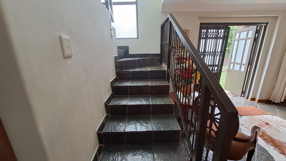 Staircase  in entrance hall leading upstairs