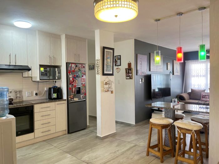 Coastal townhouse for sale in Scottburgh Central with balcony, garage, and amenities.