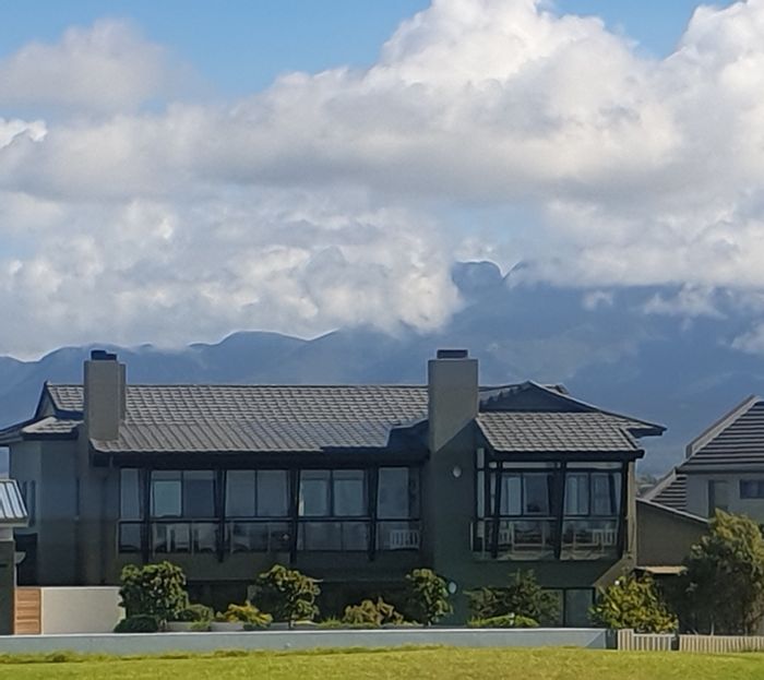 Oubaai House For Sale: Golf course views, solar power, three garages, and pool.