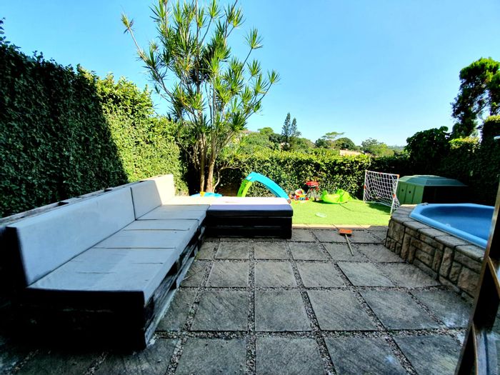 For Sale: Glen Hills Townhouse with 3 bedrooms, patio, garage, and outdoor shower.