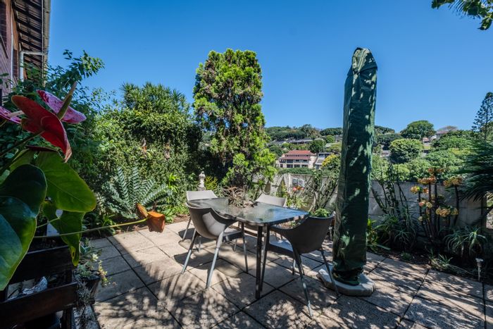 For Sale: Glen Hills Townhouse with 3 bedrooms, patio, garage, and outdoor shower.