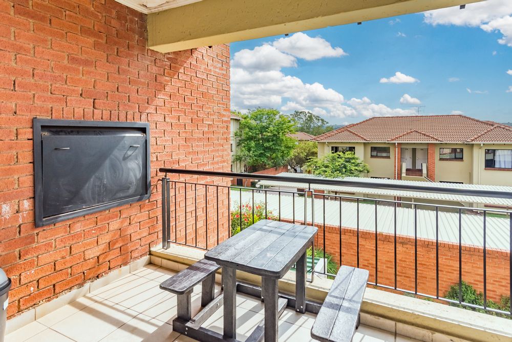 covered patio with built in braai