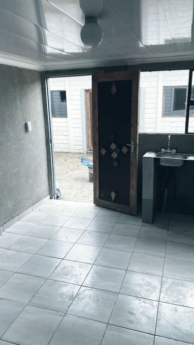 To Rent: Bachelor Apartment in Tokoza Ext 2 with kitchen, bathroom, and parking.