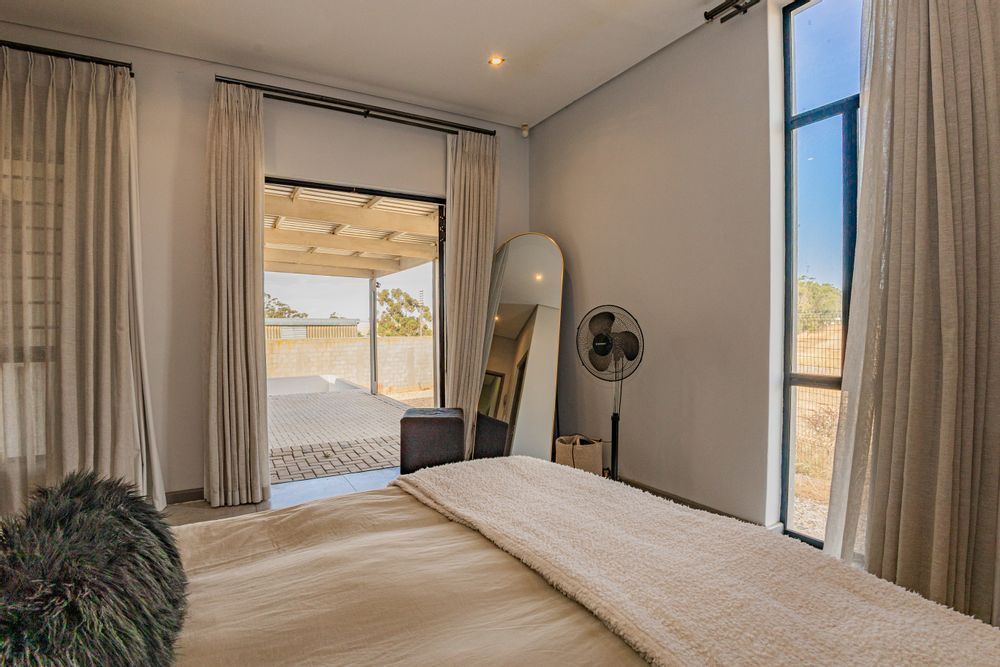 Main bedroom with private covered patio