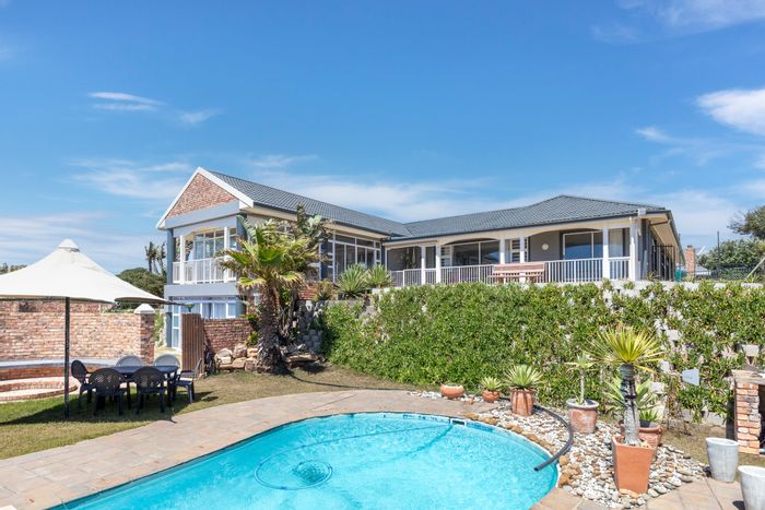 Beachfront house in West Beach for sale with pool, flatlets, and ocean views.