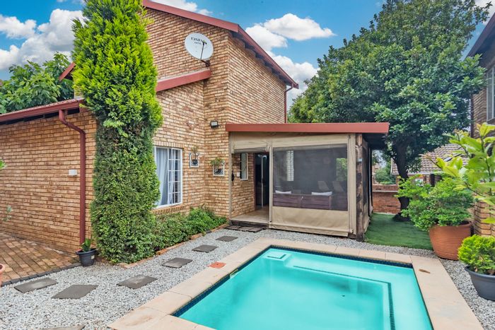 For Sale: Wilgeheuwel Townhouse with pool, loft, double garage, and solar system.