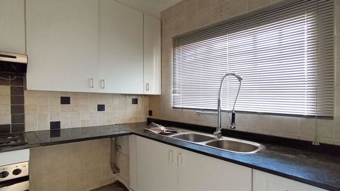 Woodmead Townhouse For Sale: 2 bedrooms, open-plan living, carport, near amenities.