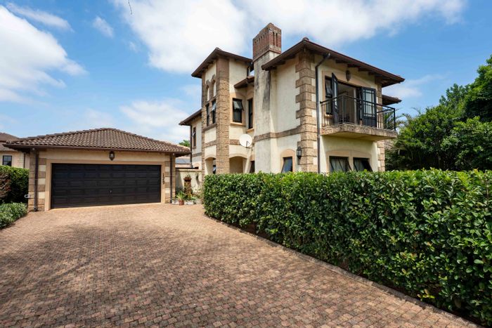 For Sale: Townhouse in Plantations Estate with garden, double garage, and balconies.