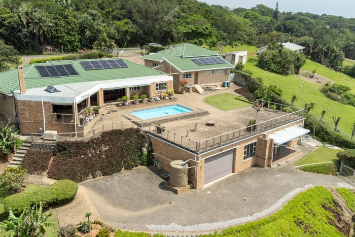 For Sale: House in Bazley Beach with panoramic sea views and extensive garaging.