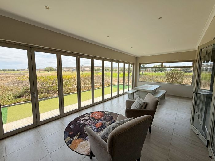 For Sale: House in Langebaan Country Estate with golf views, spacious living, and garage.