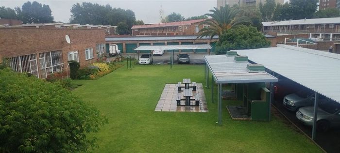 Spacious 2-bedroom flat in Benoni Central with communal garden and secure parking. For Sale.