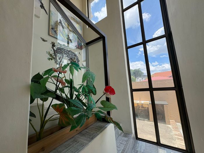 For Sale: 4-Bedroom Townhouse in Waterval East with Office, Balcony, and Parking.