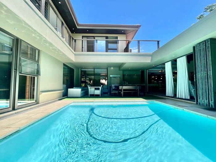 For Sale: House in Port Zimbali Estate with pool, flat, and designer kitchen.