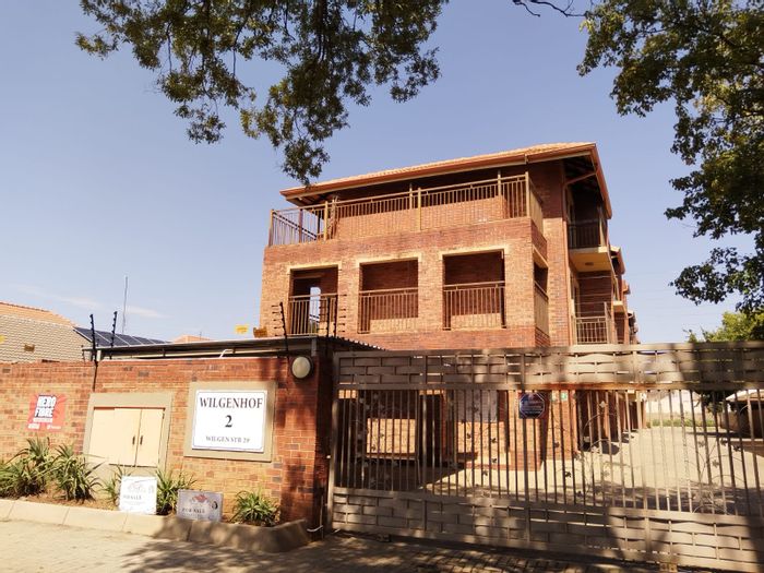 For Sale: 2-bedroom apartment in Die Bult, near NWU, secure parking, rental potential.