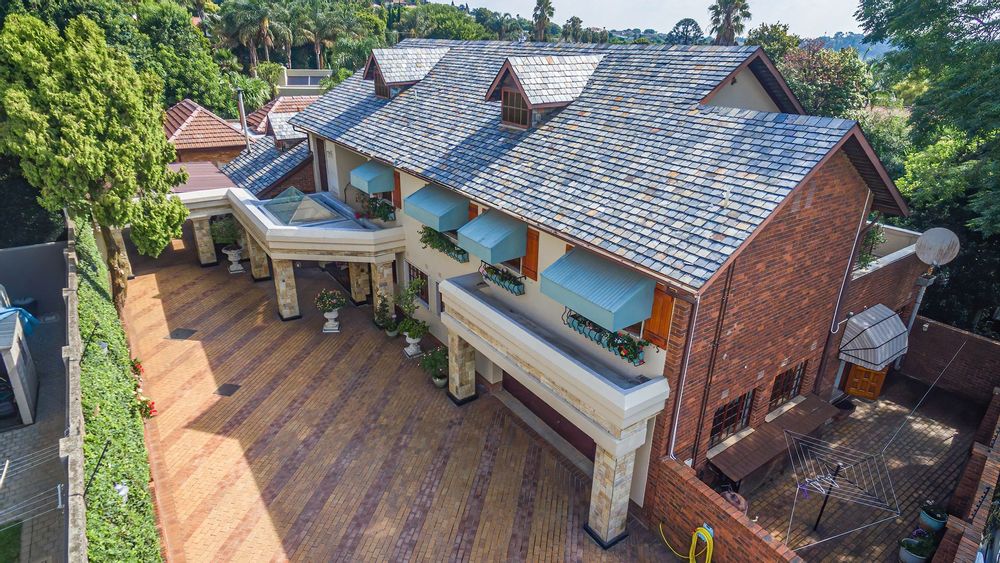 Main home is slate roofed and staff and yoga studio is tiled